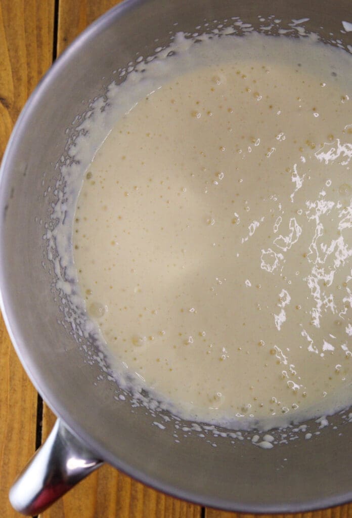 Image of mixing the yogurt with eggs, oil, baking soda and salt.